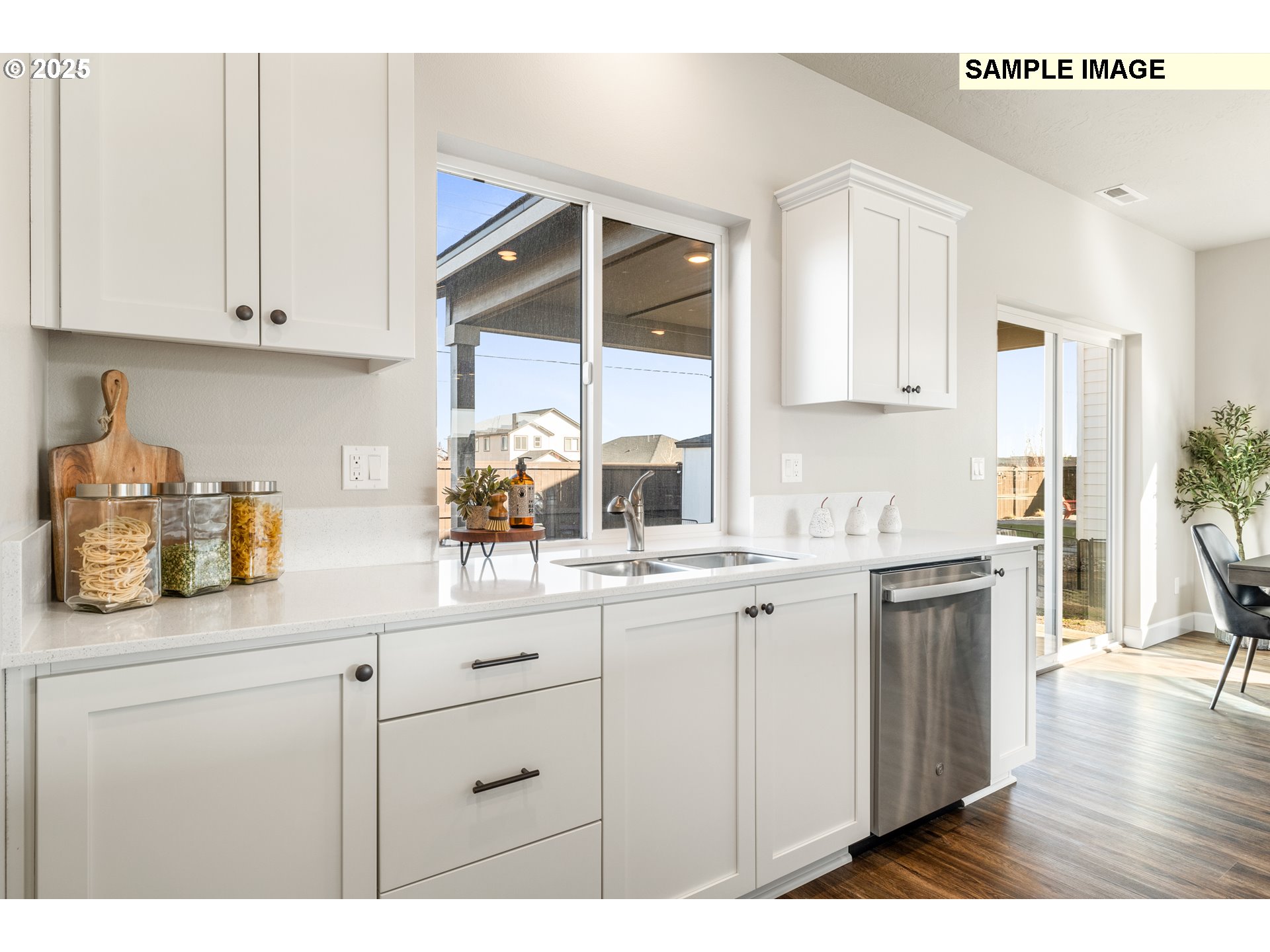 548 Arthur Street Umatilla, OR 97882 - Photo 14 of 36 a kitchen with white cabinets and sink