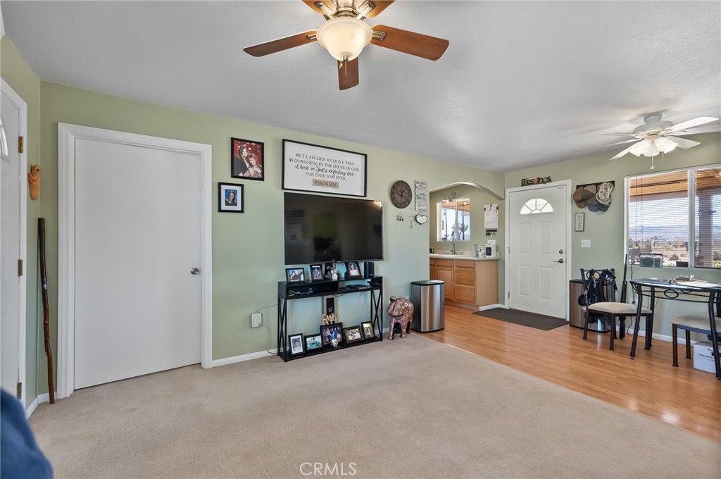 880 Inca Trail Yucca Valley, CA 92284 - Photo 11 of 26 a view of a livingroom with furniture and a flat screen tv