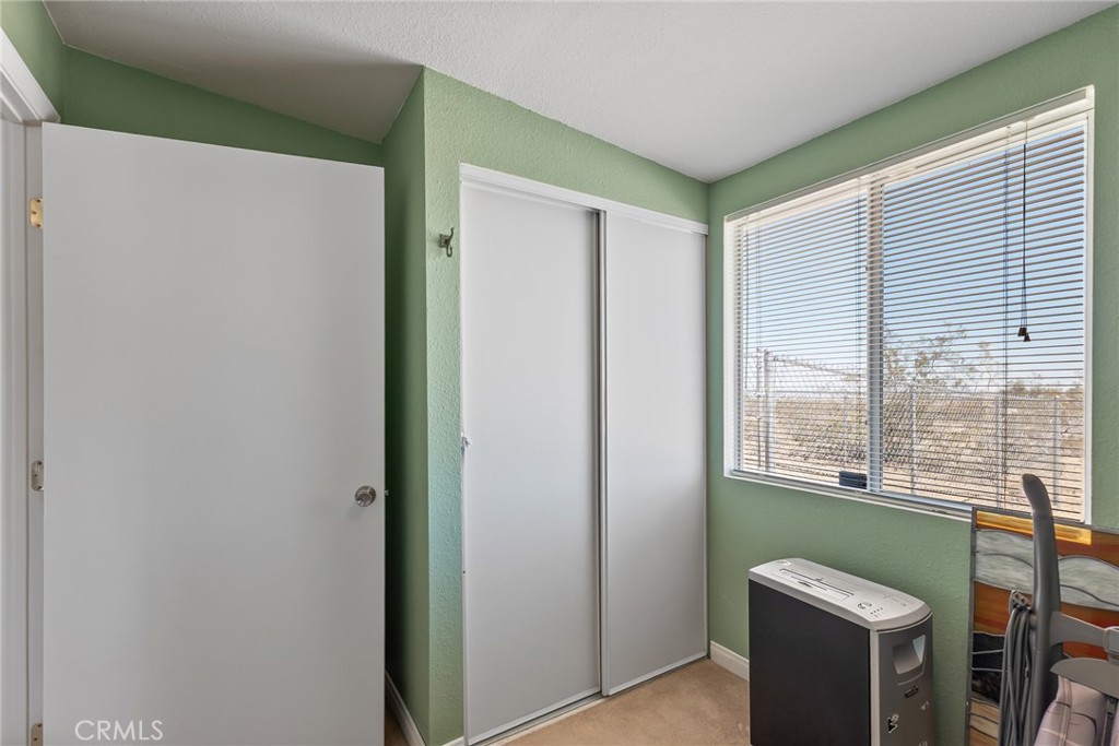 880 Inca Trail Yucca Valley, CA 92284 - Photo 18 of 26 a view of a room that has a window and a kitchen