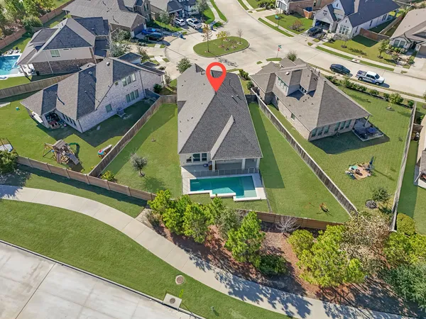 an aerial view of a house with a garden