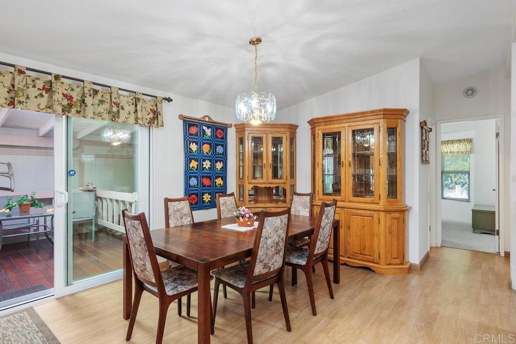 18218 Paradise Mountain Road Valley Center, CA 92082 - Photo 12 of 39 a view of a dining room with furniture window and wooden floor