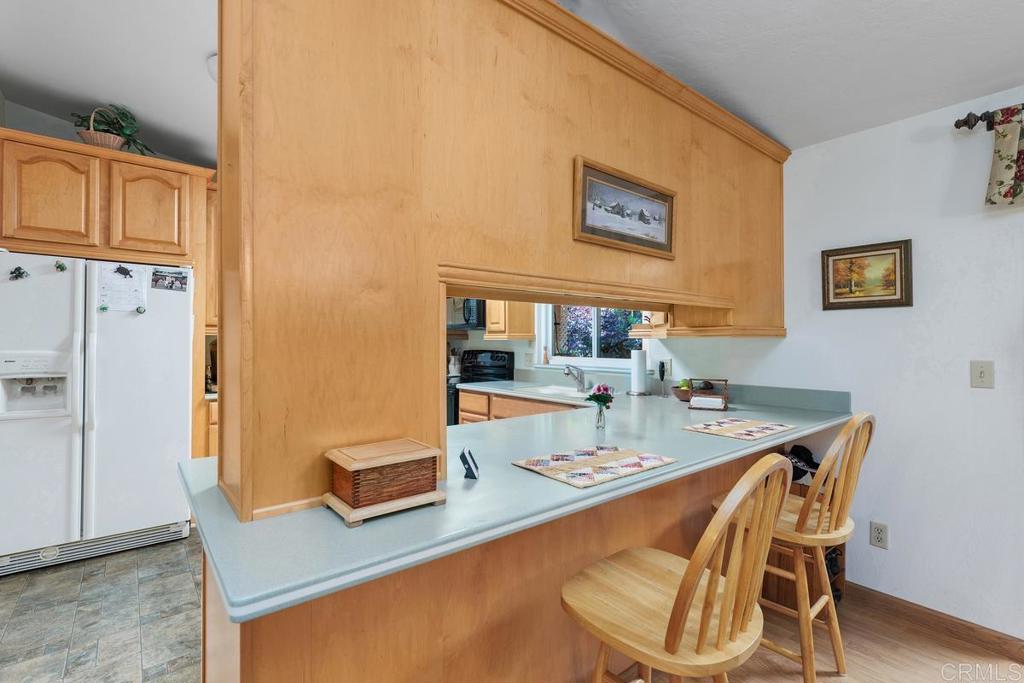 18218 Paradise Mountain Road Valley Center, CA 92082 - Photo 13 of 39 a dining room with furniture and wooden floor
