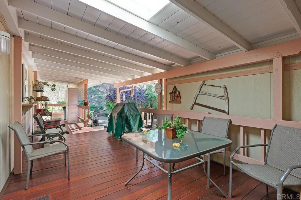 18218 Paradise Mountain Road Valley Center, CA 92082 - Photo 28 of 39 a living room with furniture and wooden floor