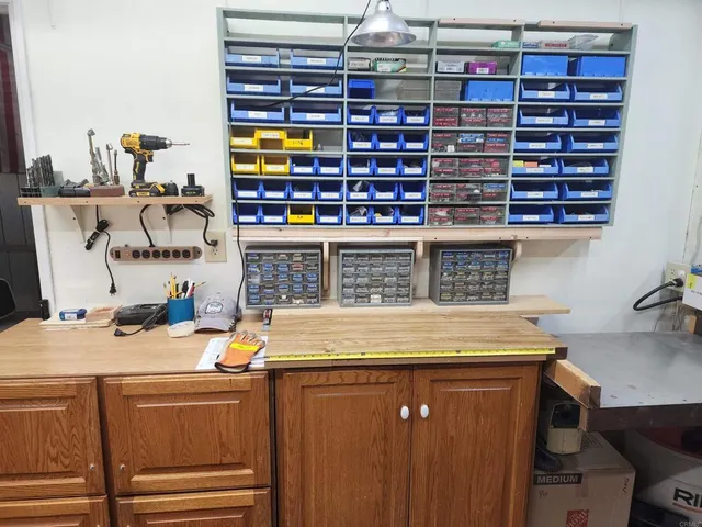 a room with stainless steel appliances and cabinets