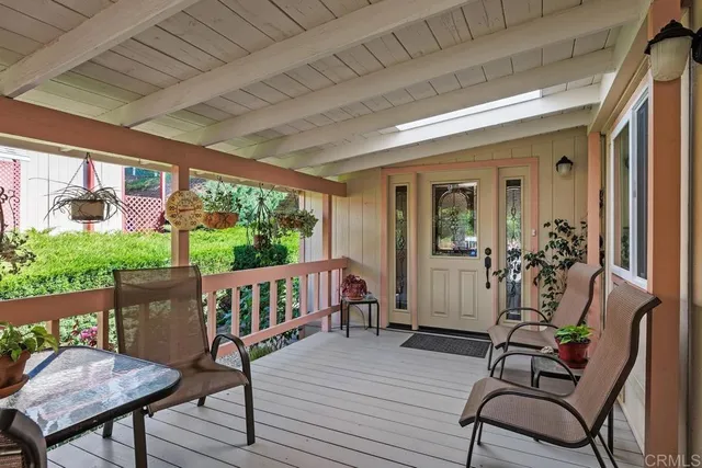a view of a porch with furniture