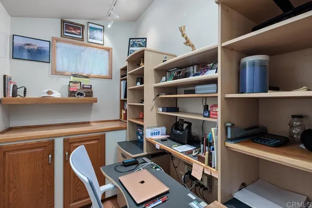 a view of workspace with cabinets