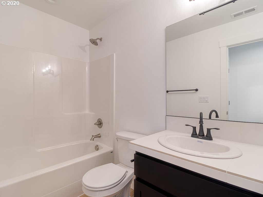 70 South 39th Drive Ridgefield, WA 98642 - Photo 18 of 24 a bathroom with a sink a toilet and a bathtub