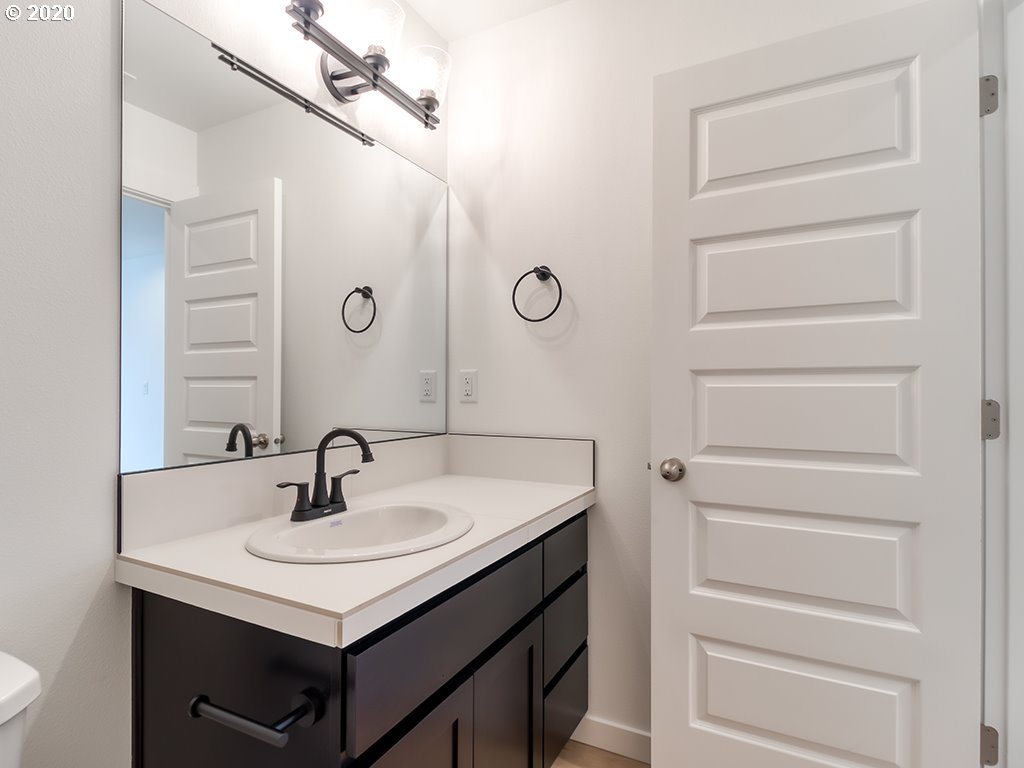 70 South 39th Drive Ridgefield, WA 98642 - Photo 19 of 24 a bathroom with a sink vanity and a mirror
