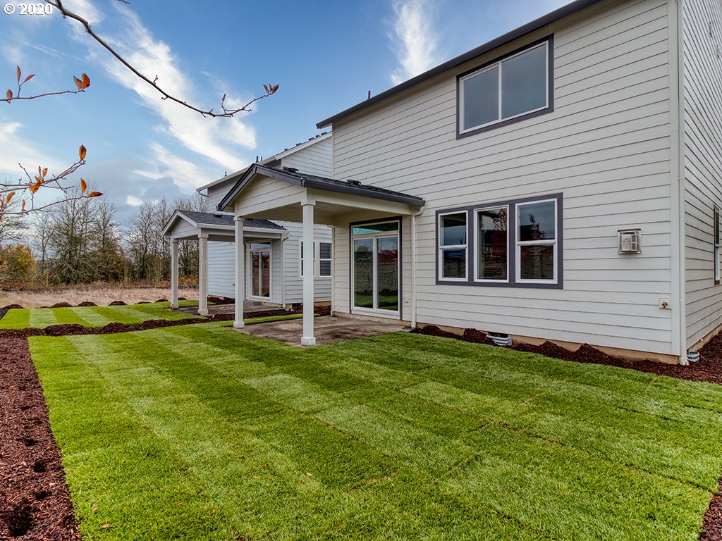 70 South 39th Drive Ridgefield, WA 98642 - Photo 2 of 24 a view of a house with a backyard and porch