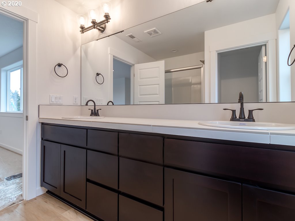 70 South 39th Drive Ridgefield, WA 98642 - Photo 24 of 24 a bathroom with a sink and mirror