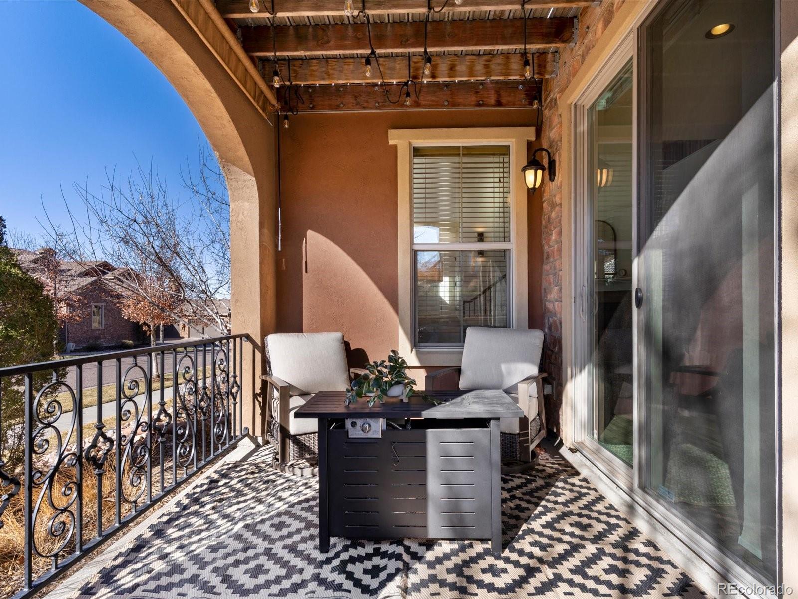 9340 Sori Lane Highlands Ranch, CO 80126 - Photo 18 of 42 a view of balcony with wooden floor and outdoor seating