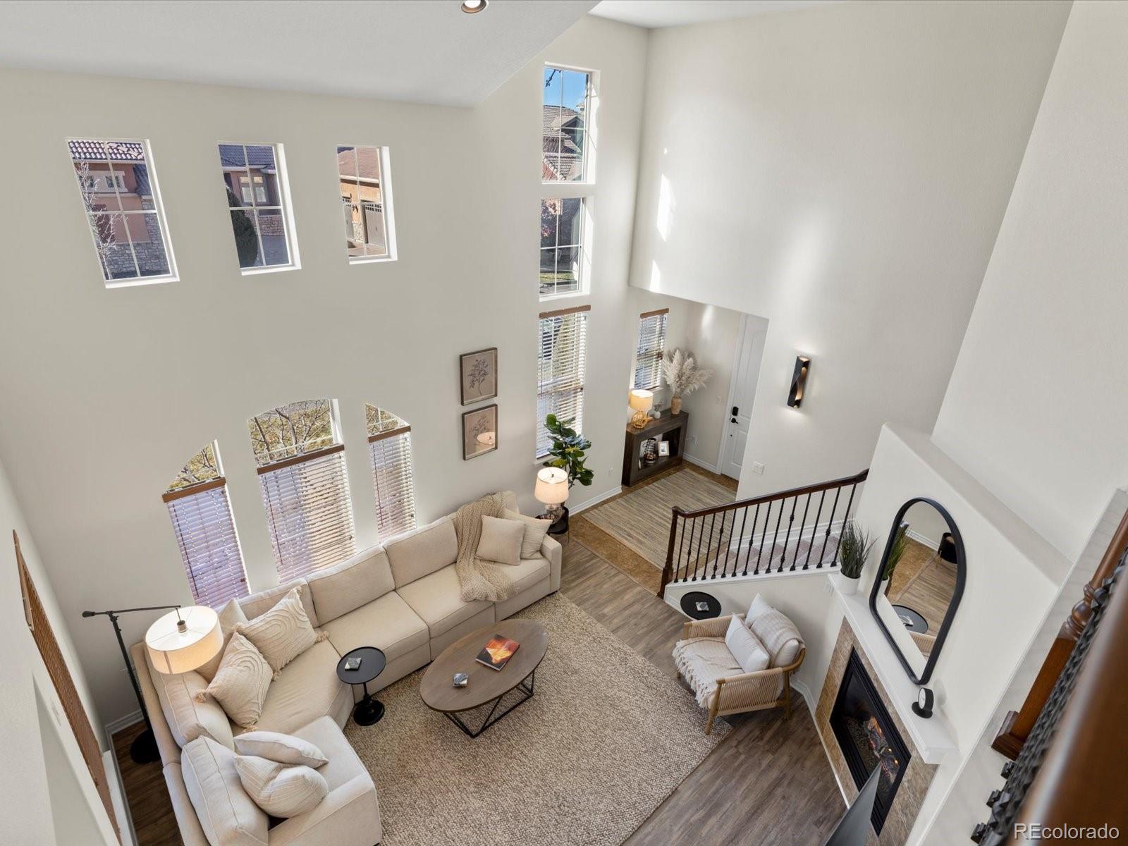 9340 Sori Lane Highlands Ranch, CO 80126 - Photo 22 of 42 a bedroom with furniture and a wooden floor
