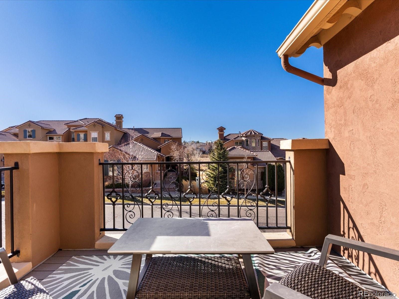 9340 Sori Lane Highlands Ranch, CO 80126 - Photo 32 of 42 a view of a patio with couches chairs and wooden floor