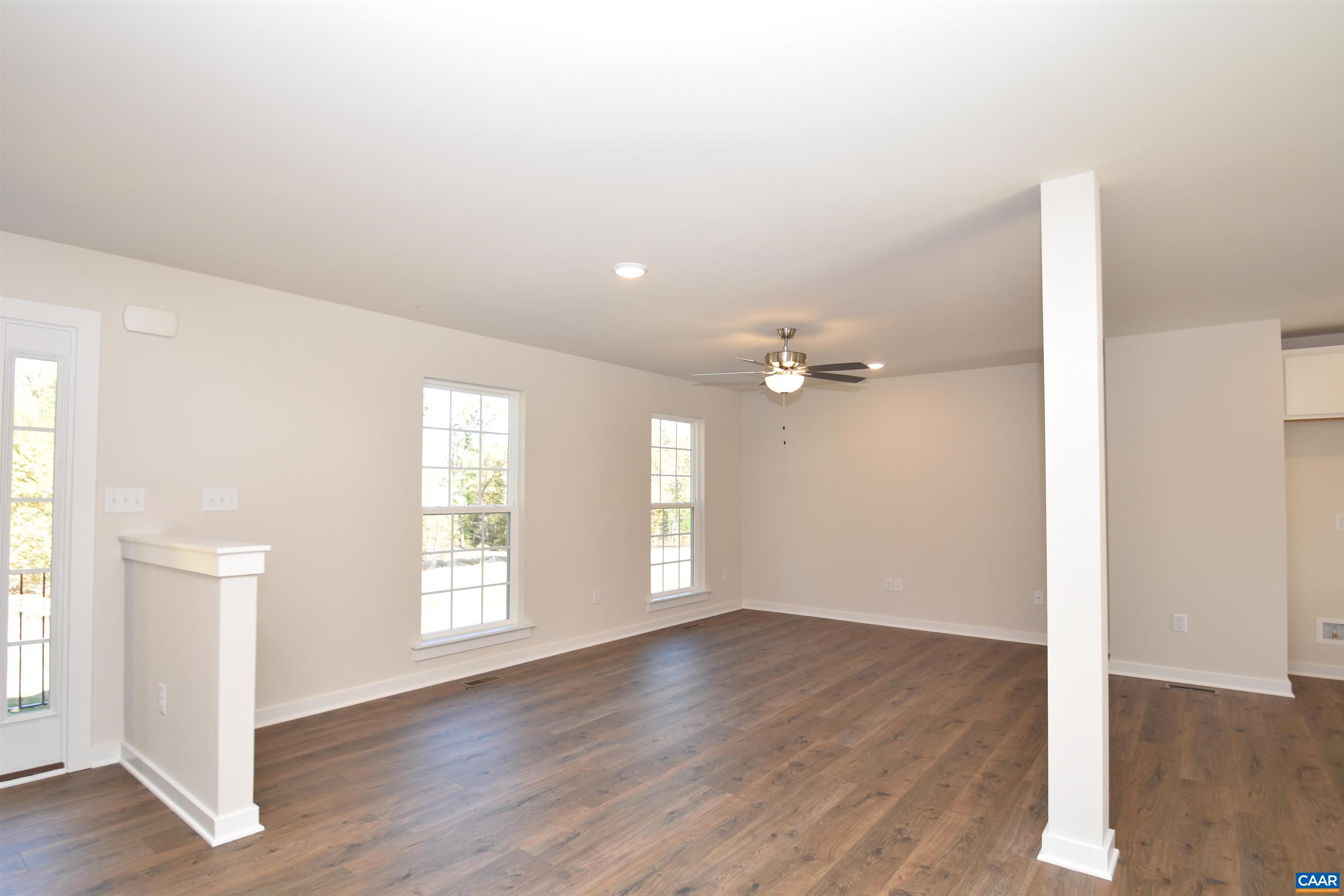2600 Doctors Road Louisa, VA 23093 - Photo 15 of 25 an empty room with wooden floor and windows