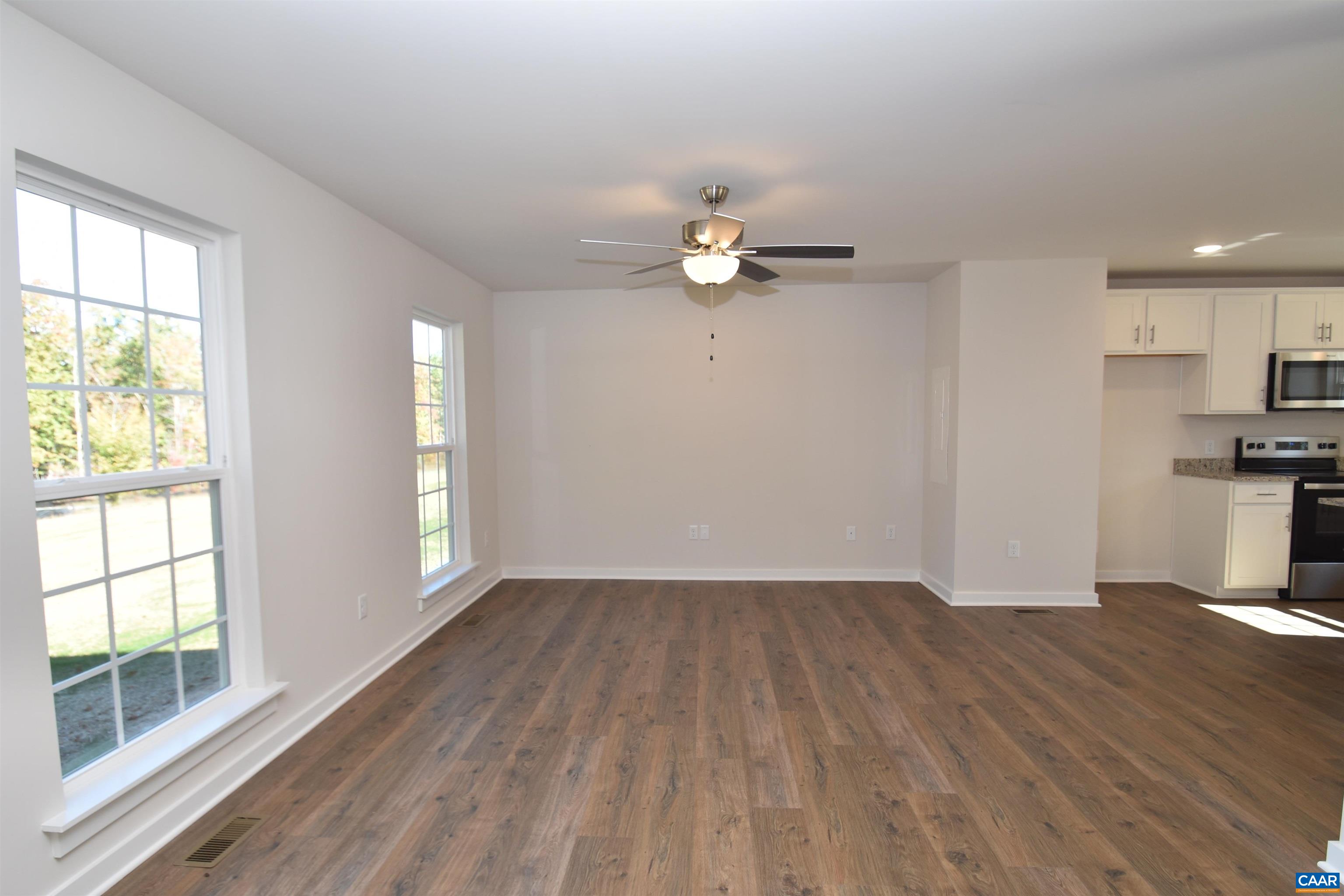 2600 Doctors Road Louisa, VA 23093 - Photo 4 of 25 a view of empty room with wooden floor and fan