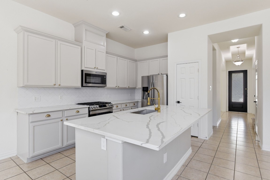 16023 Powder Springs Lane Houston, TX 77070 - Photo 16 of 48 The updated quartz counter tops, freshly painted cabinets with updated hardware just make this kitchen pop! The updated faucet adds such a modern touch. Recently replaced stove!