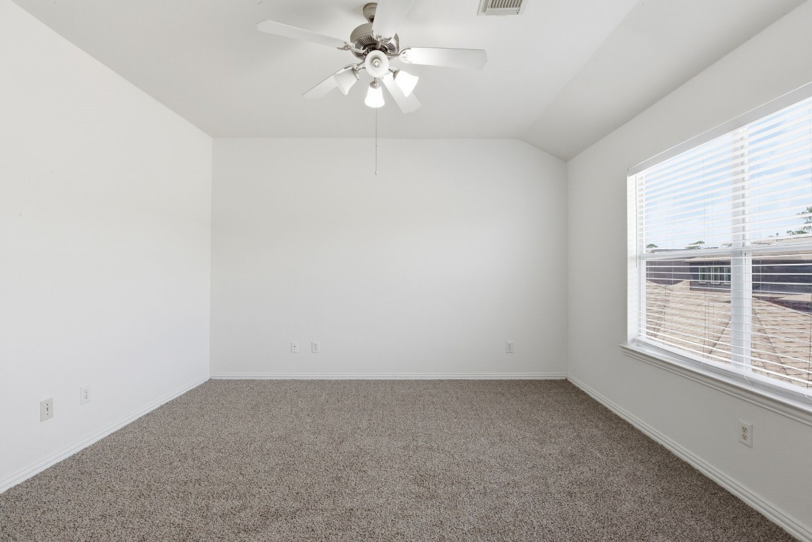 16023 Powder Springs Lane Houston, TX 77070 - Photo 28 of 48 This large primary bedroom is upstairs. It has fresh paint, recently replaced carpet, updated ceiling fan, white faux wood blinds.