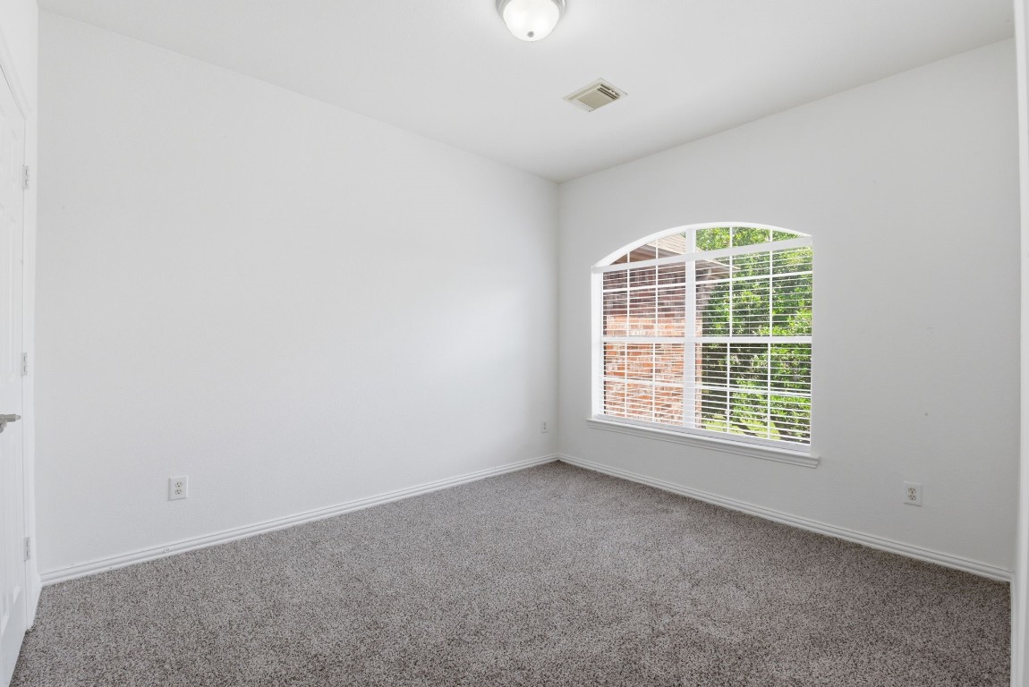 16023 Powder Springs Lane Houston, TX 77070 - Photo 35 of 48 Second bedroom upstairs with fresh neutral paint, recently replaced carpet and a fantastic window letting in so much natural light!