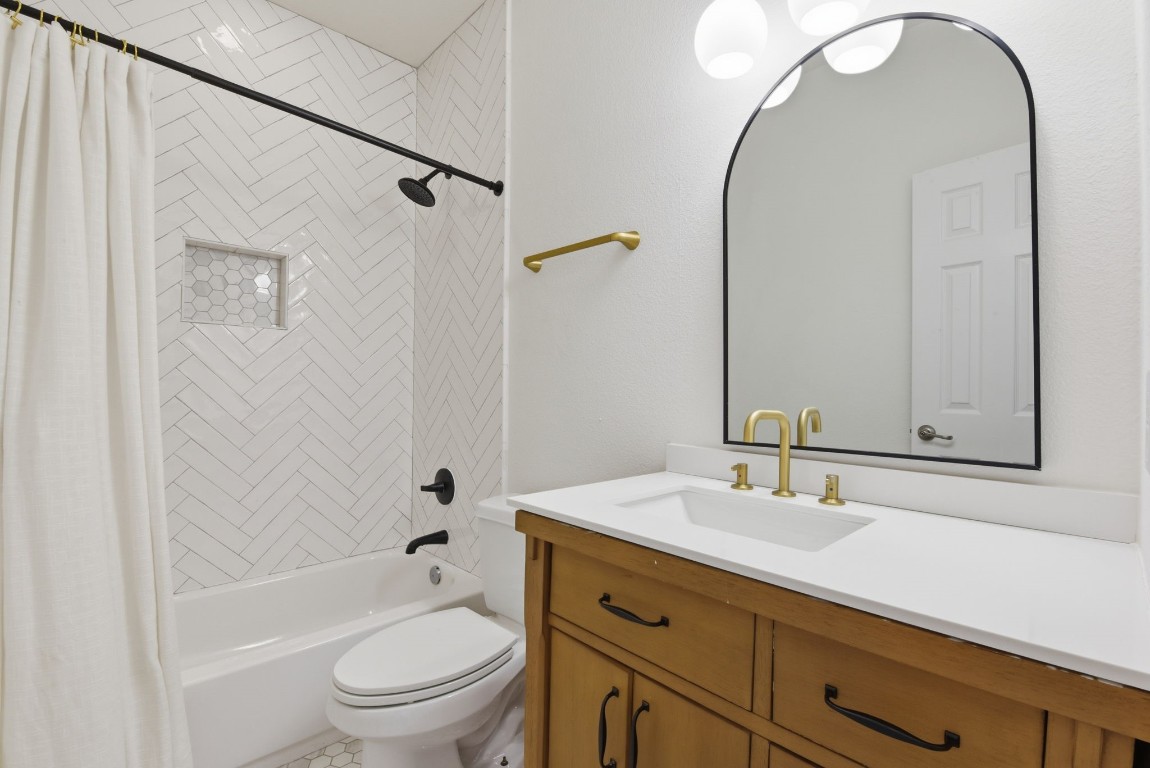 16023 Powder Springs Lane Houston, TX 77070 - Photo 38 of 48 Updated secondary full bathroom upstairs! Check out the completely updated vanity, updated mirror, lighting and shower! The floor has been updated as well!