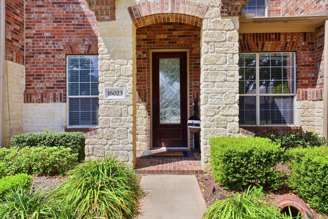16023 Powder Springs Lane Houston, TX 77070 - Photo 4 of 48 Nice covered porch welcomes you right in. Keypad lock on door will stay with the property.