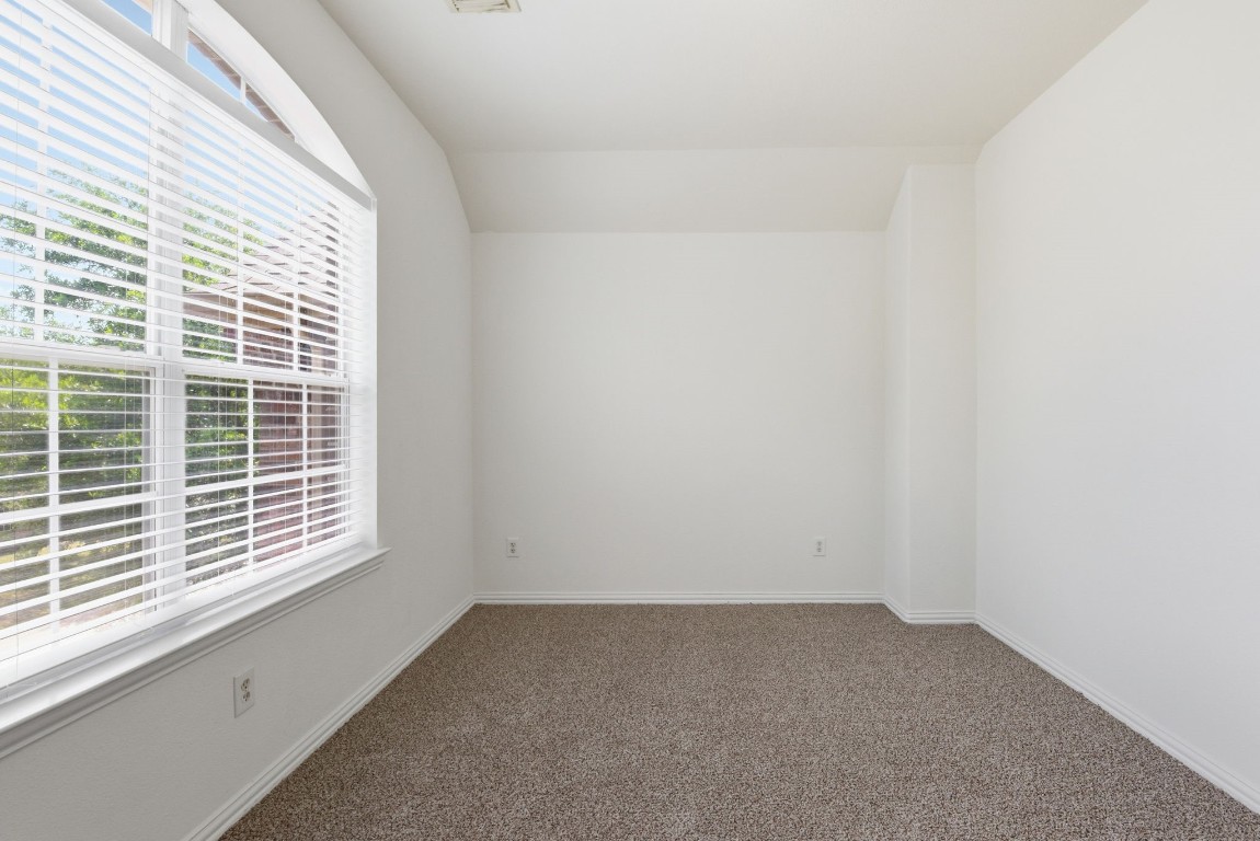 16023 Powder Springs Lane Houston, TX 77070 - Photo 40 of 48 The finished off loft/flex room with fresh paint, white faux wood blinds, recently replaced carpet.