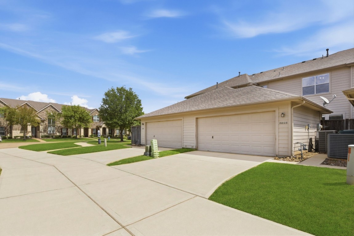16023 Powder Springs Lane Houston, TX 77070 - Photo 44 of 48 A view from the back of the home. The double wide driveway leads to an attached two car garage with epoxy floors!