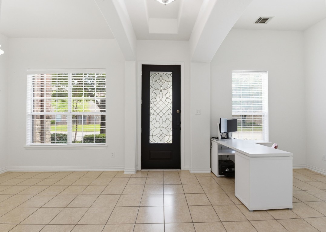 16023 Powder Springs Lane Houston, TX 77070 - Photo 5 of 48 Beautiful wood/glass front door opens up to a huge entry way! To the left in this picture is the formal dining area. To the right is a flex space that has been used as the home office!