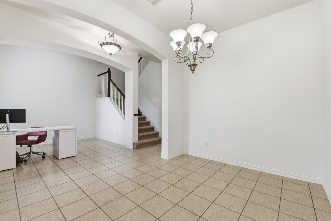 16023 Powder Springs Lane Houston, TX 77070 - Photo 10 of 48 The formal dining room is off of the entry way and has plenty of room for your dining room set! Look how open this whole area is!