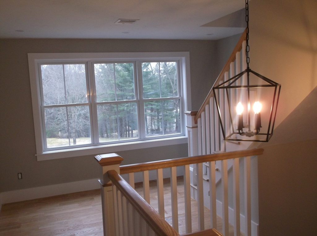 Lot 8 Pond View Holliston, MA 01746 - Photo 20 of 30 a view of entryway with wooden floor