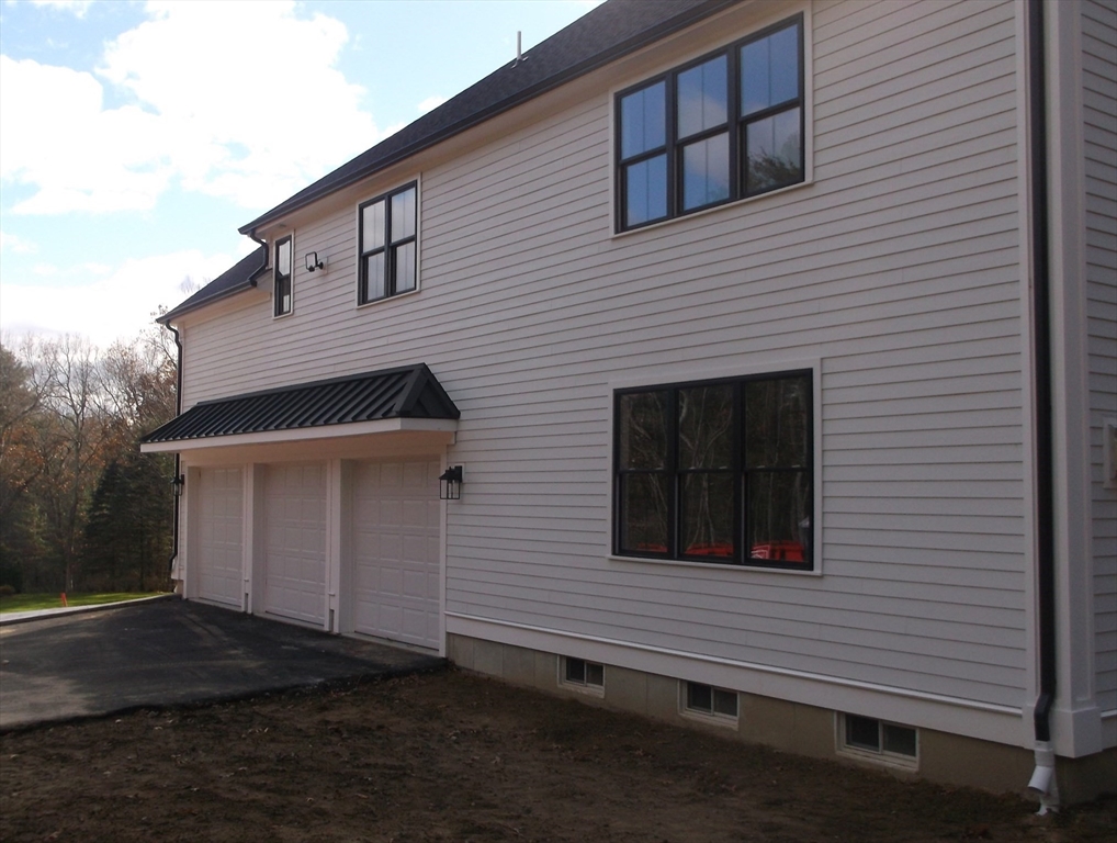 Lot 8 Pond View Holliston, MA 01746 - Photo 2 of 30 a side view of a house
