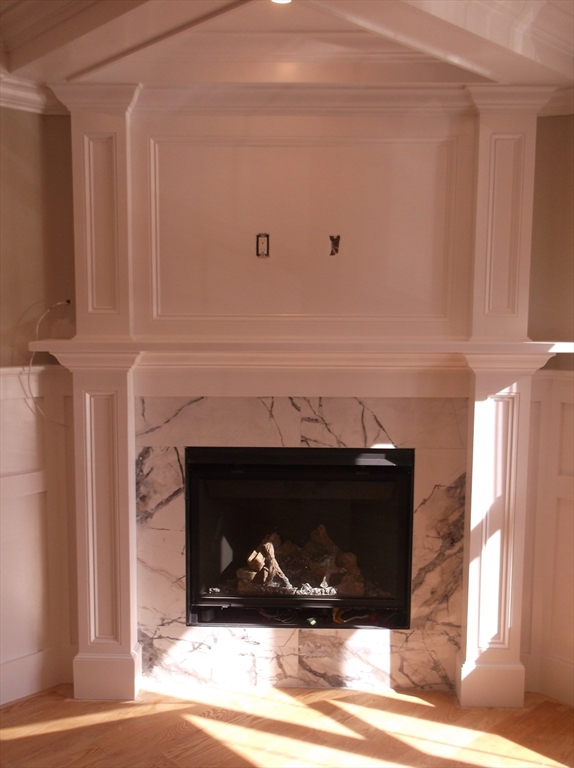 Lot 8 Pond View Holliston, MA 01746 - Photo 26 of 30 a living room with a fireplace in it
