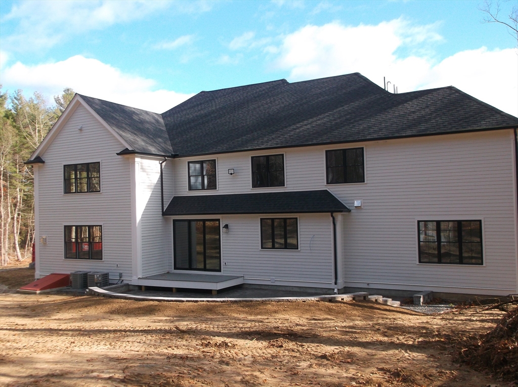 Lot 8 Pond View Holliston, MA 01746 - Photo 3 of 30 a house that has a large tree in front of it