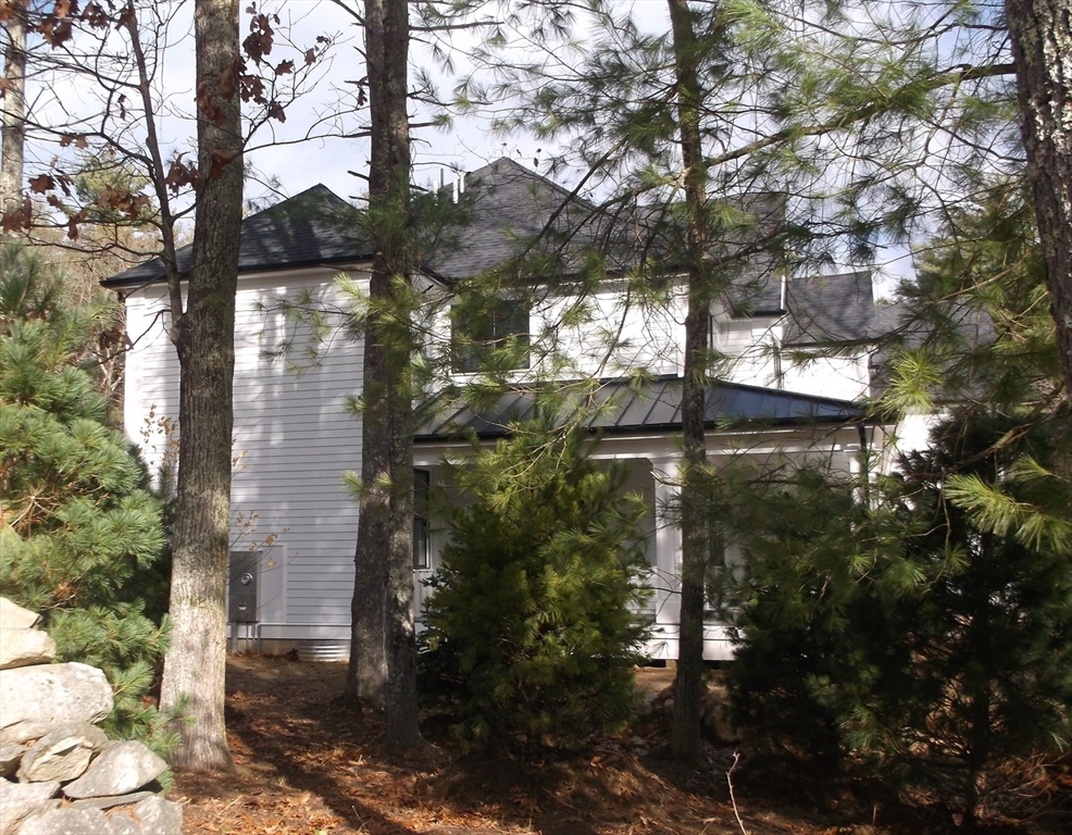 Lot 8 Pond View Holliston, MA 01746 - Photo 4 of 30 a backyard of a house with lots of green space