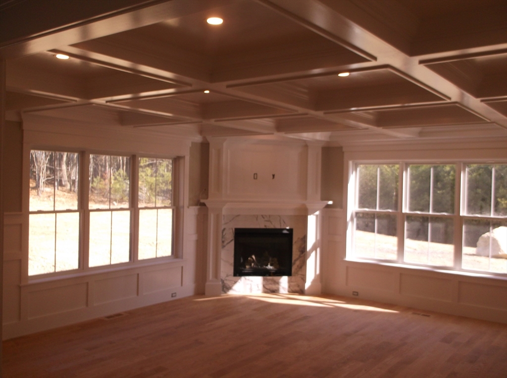 Lot 8 Pond View Holliston, MA 01746 - Photo 7 of 30 a view of an empty room with a fireplace and a window