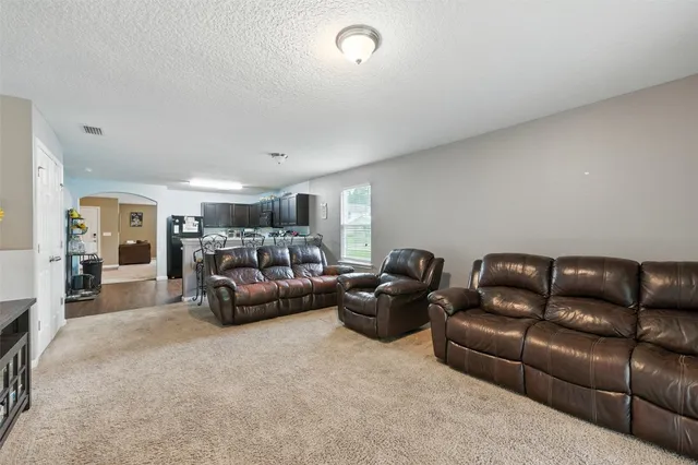 a living room with furniture and a couch