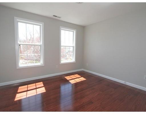 4 Jasmine Drive Worcester, MA 01605 - Photo 12 of 23 an empty room with wooden floor and windows