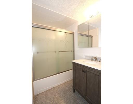 4 Jasmine Drive Worcester, MA 01605 - Photo 16 of 23 a bathroom with a sink and mirror