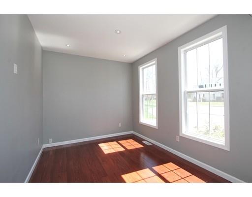 4 Jasmine Drive Worcester, MA 01605 - Photo 3 of 23 an empty room with wooden floor and windows