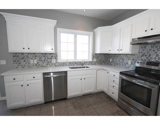 4 Jasmine Drive Worcester, MA 01605 - Photo 4 of 23 a kitchen with granite countertop white cabinets white stainless steel appliances and a sink