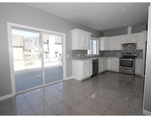 4 Jasmine Drive Worcester, MA 01605 - Photo 5 of 23 a kitchen with stainless steel appliances granite countertop a stove top oven a sink a refrigerator and a granite counter tops
