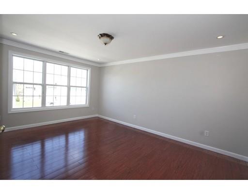4 Jasmine Drive Worcester, MA 01605 - Photo 8 of 23 a view of an empty room with wooden floor and a window