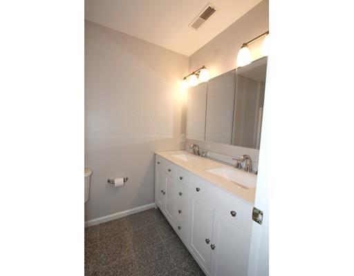 4 Jasmine Drive Worcester, MA 01605 - Photo 10 of 23 a bathroom with a double vanity sink and mirror