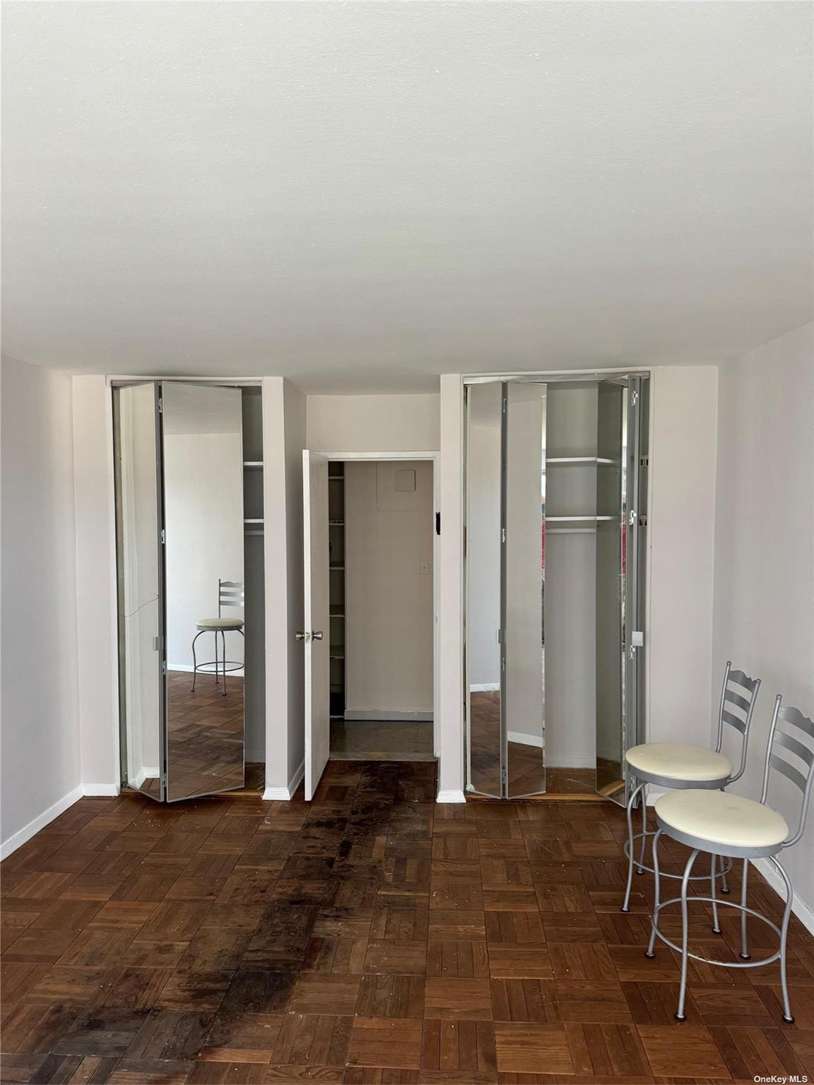 17-85 215th Street, Unit 4J Queens, NY 11360 - Photo 9 of 19 Freshly Painted Bedroom with Mirroed Doors