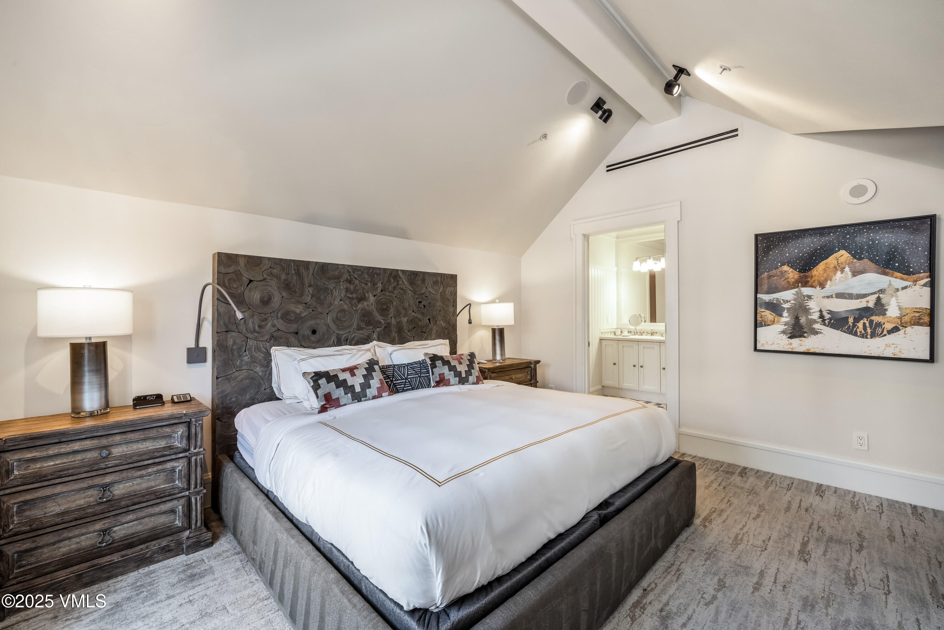 1 Willow Bridge Road, Unit 42 Vail, CO 81657 - Photo 11 of 72 a bedroom with a large bed and a lamp