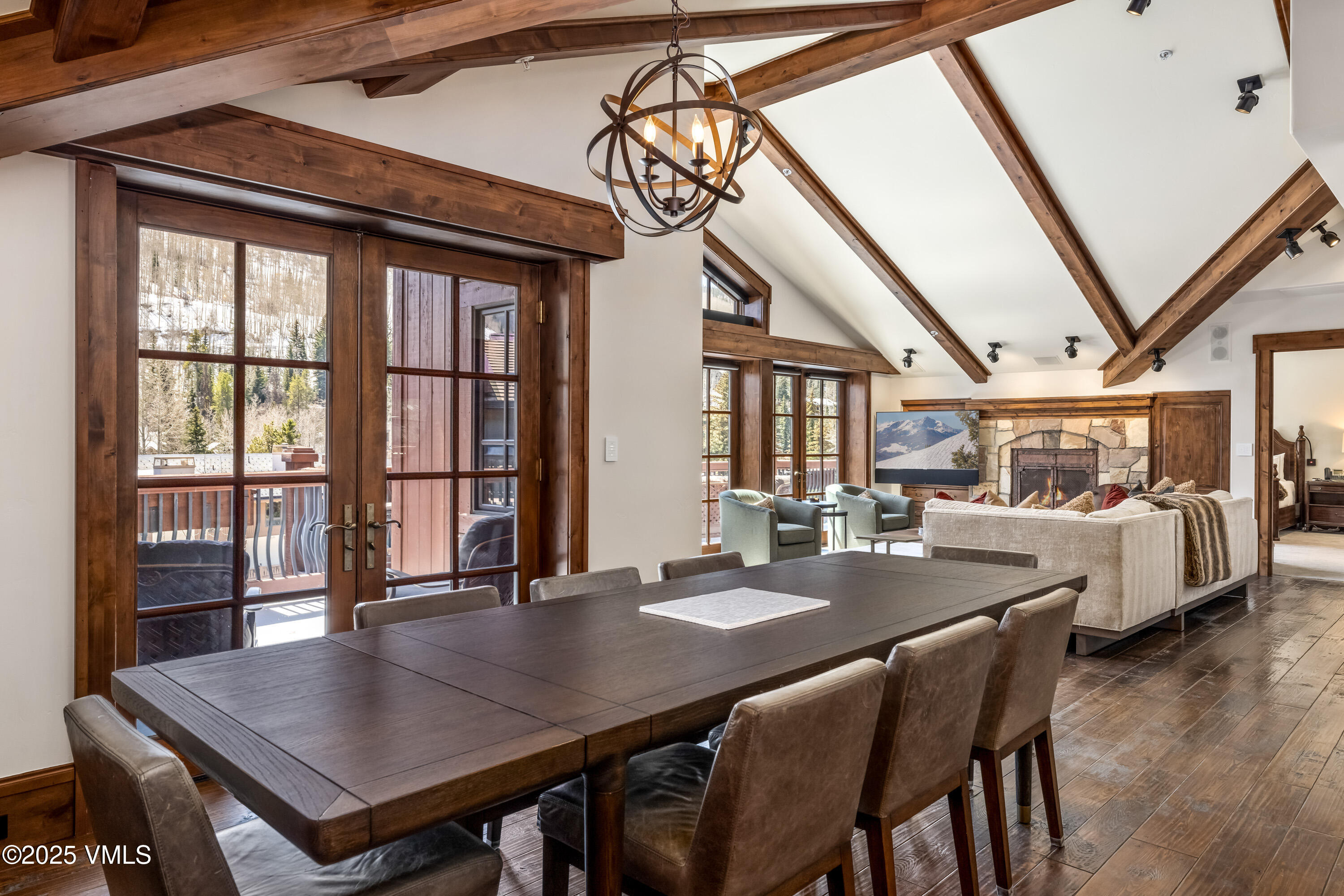 1 Willow Bridge Road, Unit 42 Vail, CO 81657 - Photo 24 of 72 a view of a dining room with furniture window and wooden floor