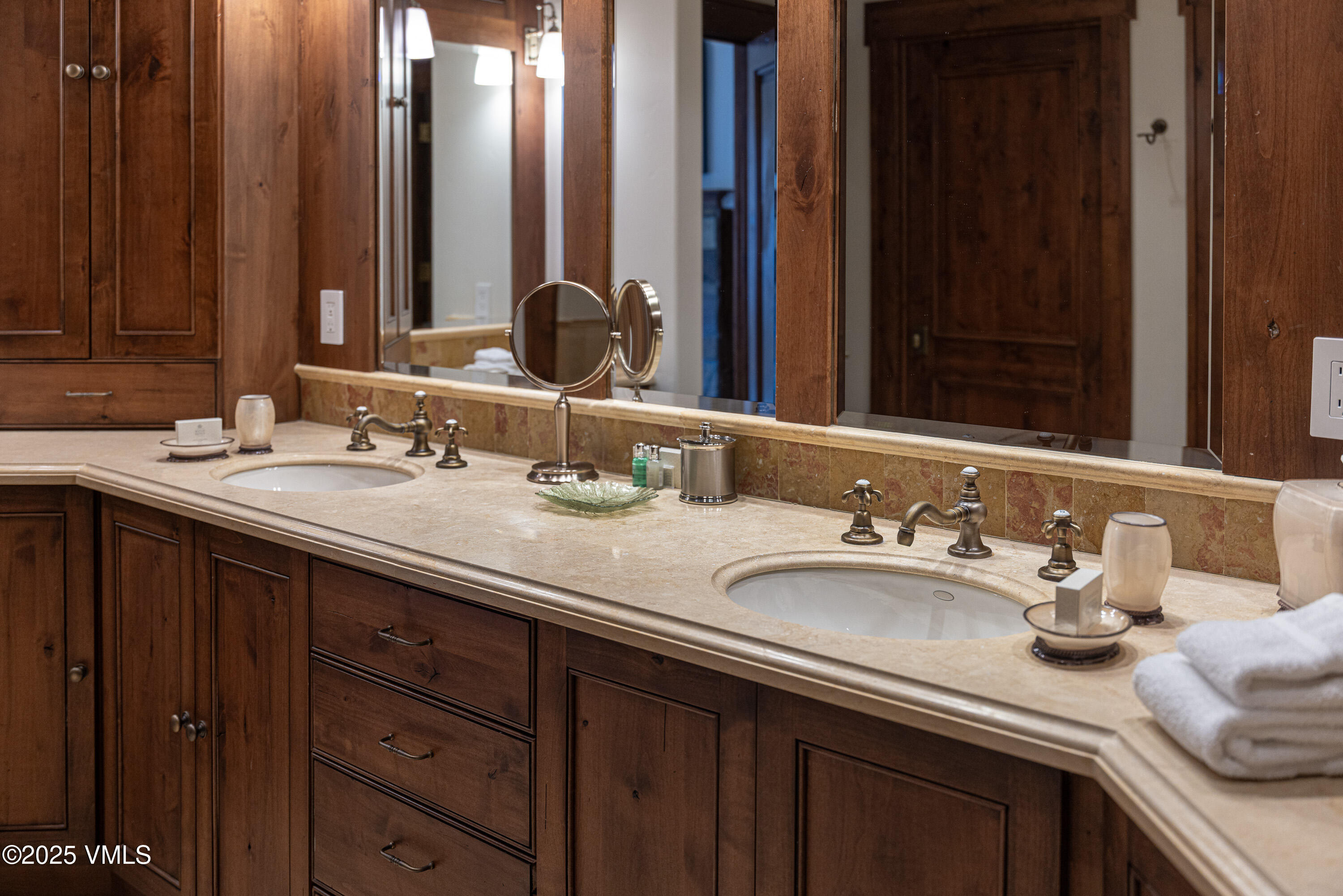 1 Willow Bridge Road, Unit 42 Vail, CO 81657 - Photo 35 of 72 a bathroom with double vanity sinks and a mirror