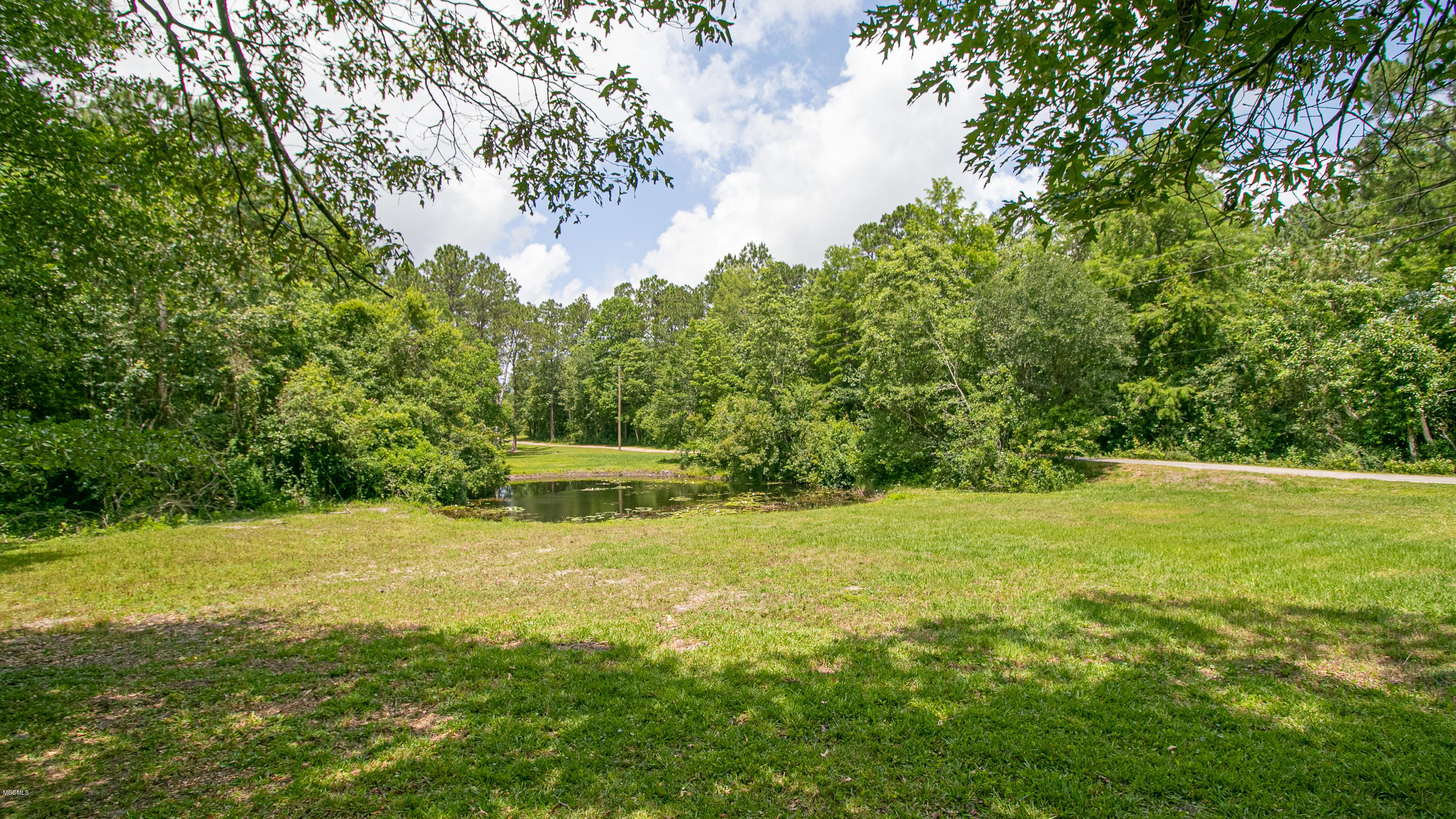 20867 Mennonite Road Gulfport, MS 39503 - Photo 9 of 47 River Creek Fed Pond