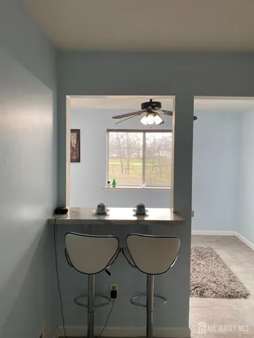 a room with two chairs and a wooden floor