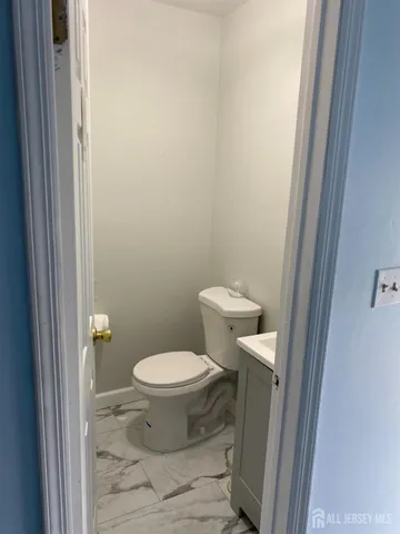 a bathroom with a toilet and a sink