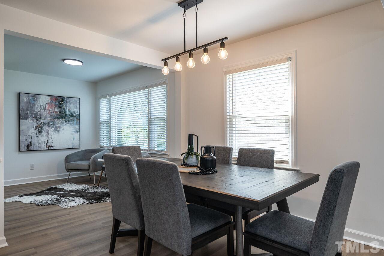 2719 Layden Street Raleigh, NC 27603 - Photo 8 of 31 a view of a dining room with furniture window and outside view